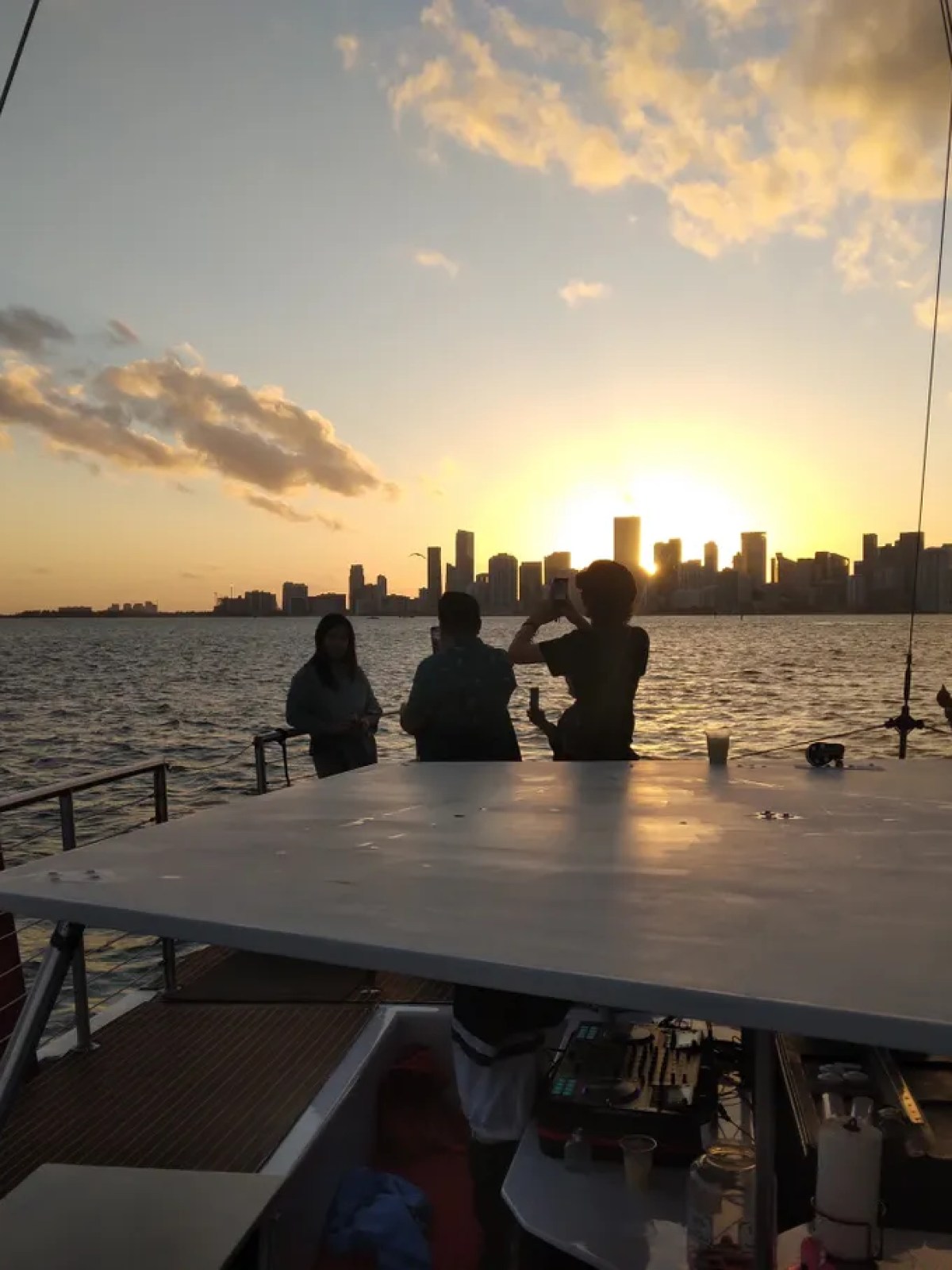 a group of people in a boat on a body of water