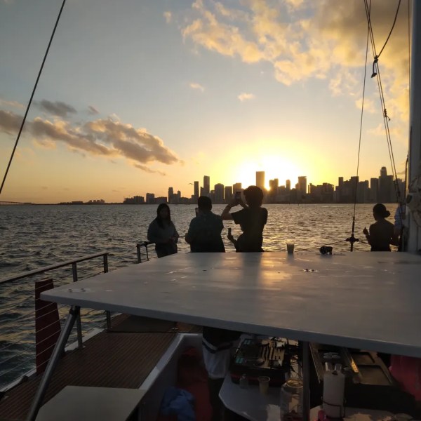 a group of people in a boat on a body of water