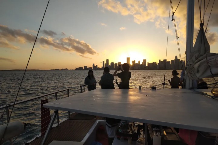 a group of people in a boat on a body of water
